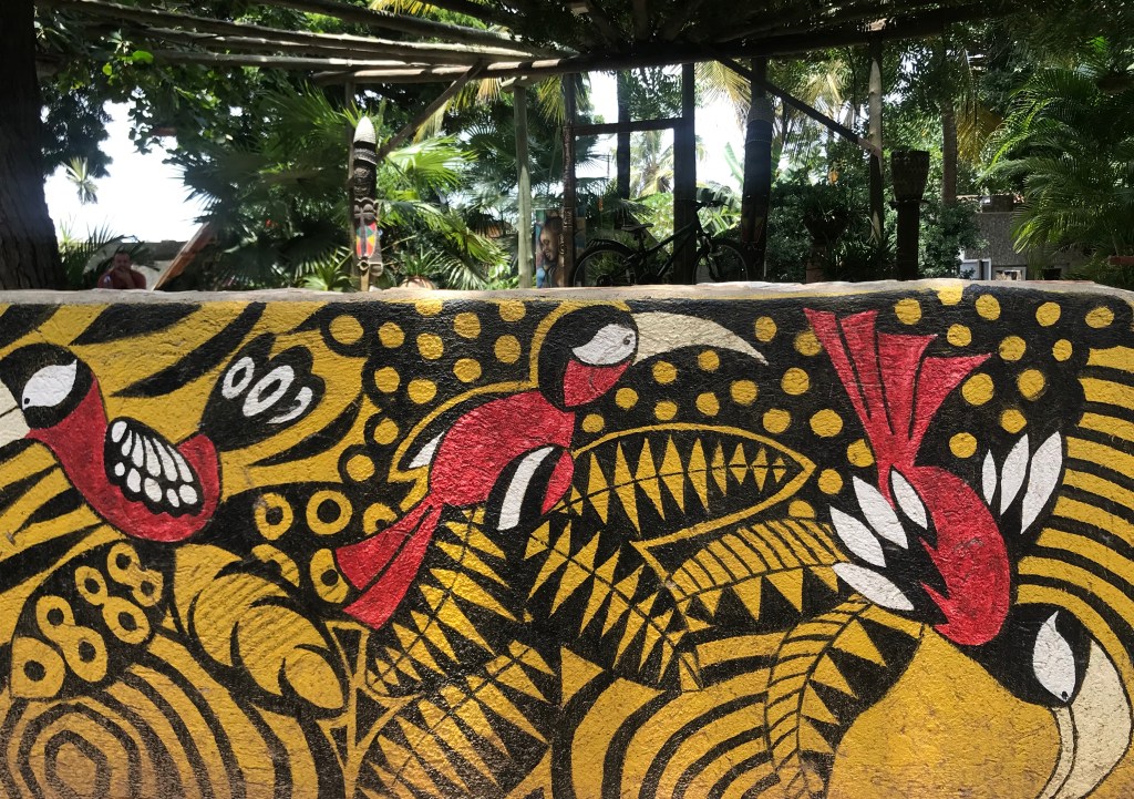 A mural of birds painted on a wall at Kokorobite gardens, Kokrobite Ghana.