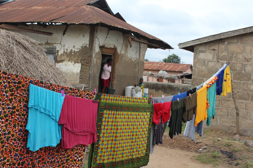 Colourful washing and African wax print fabric hanging in the village in Agortime Kpetoe