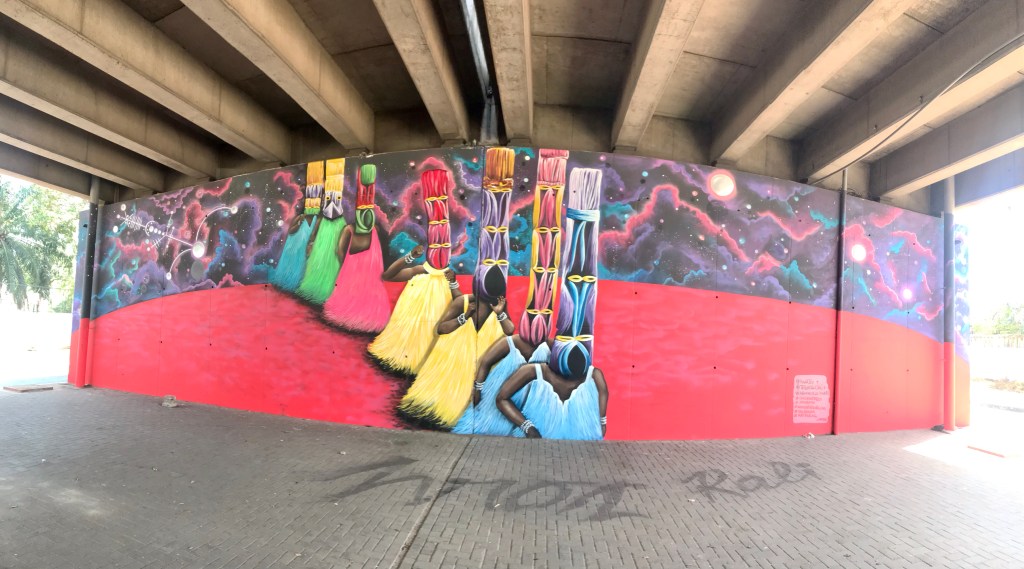 Ghana grafitti street art - A colourful mural in Accra Ghana at the Ako Adjei interchange done by talented graffiti artists.