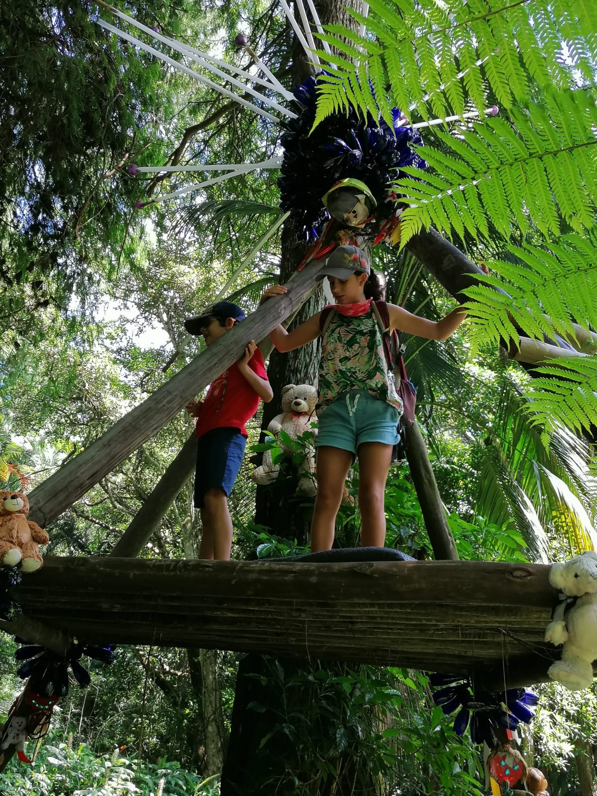 Playing in the wigwam structure at the Kloof Ammazulu Gardens and Sculpture Precinct