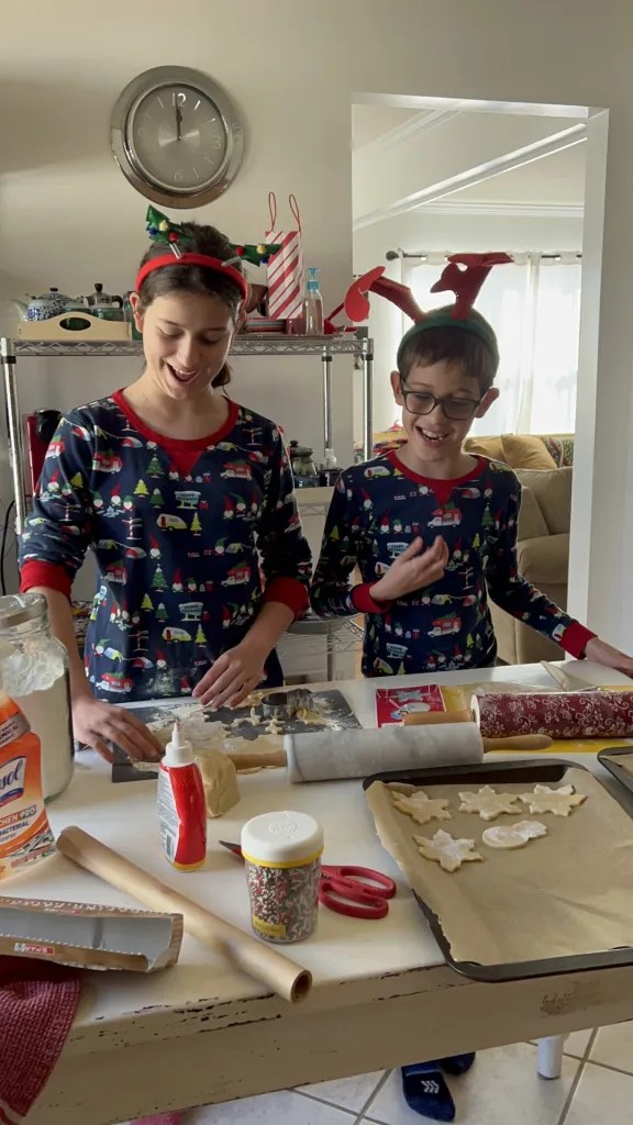 Two children baking sugar cookies on Boxing day