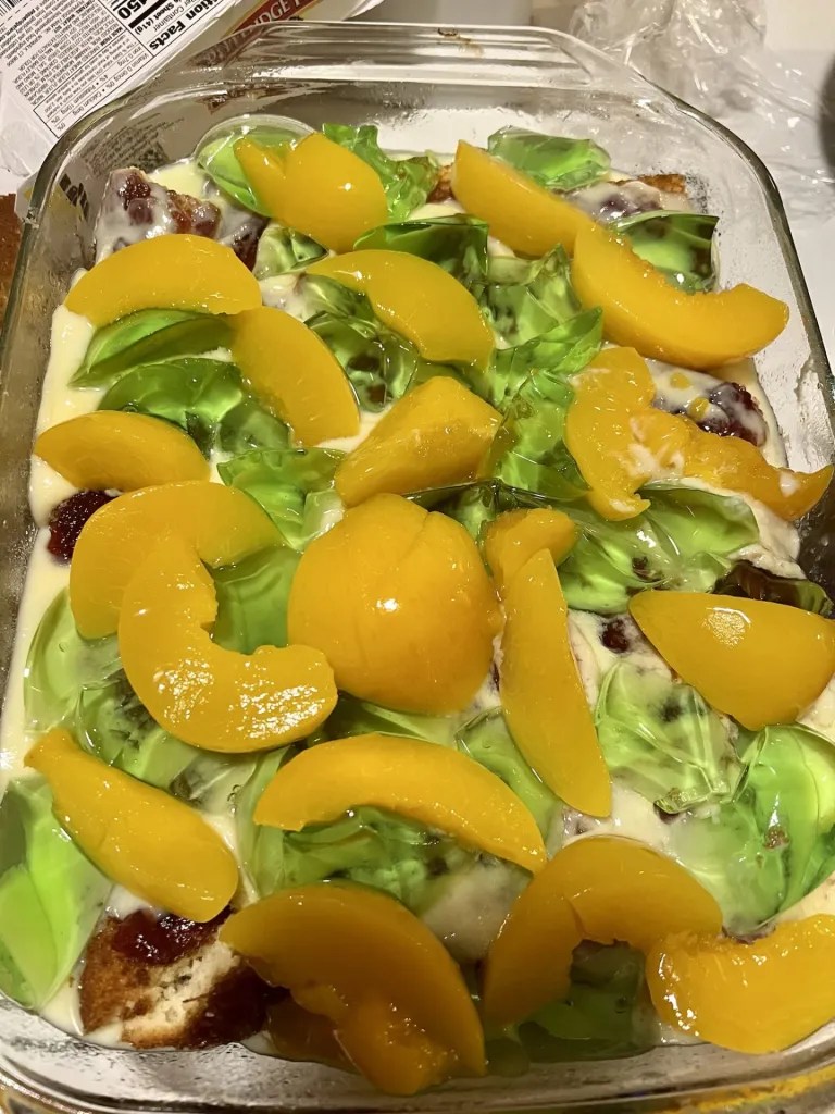 Homemade Christmas trifle a layer of tinned peaches and jelly