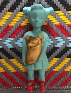 Koala Kate by Noush Projects Manoushka Kraal lies on top of a chair made by Ghanaian Joel of Calao Creations