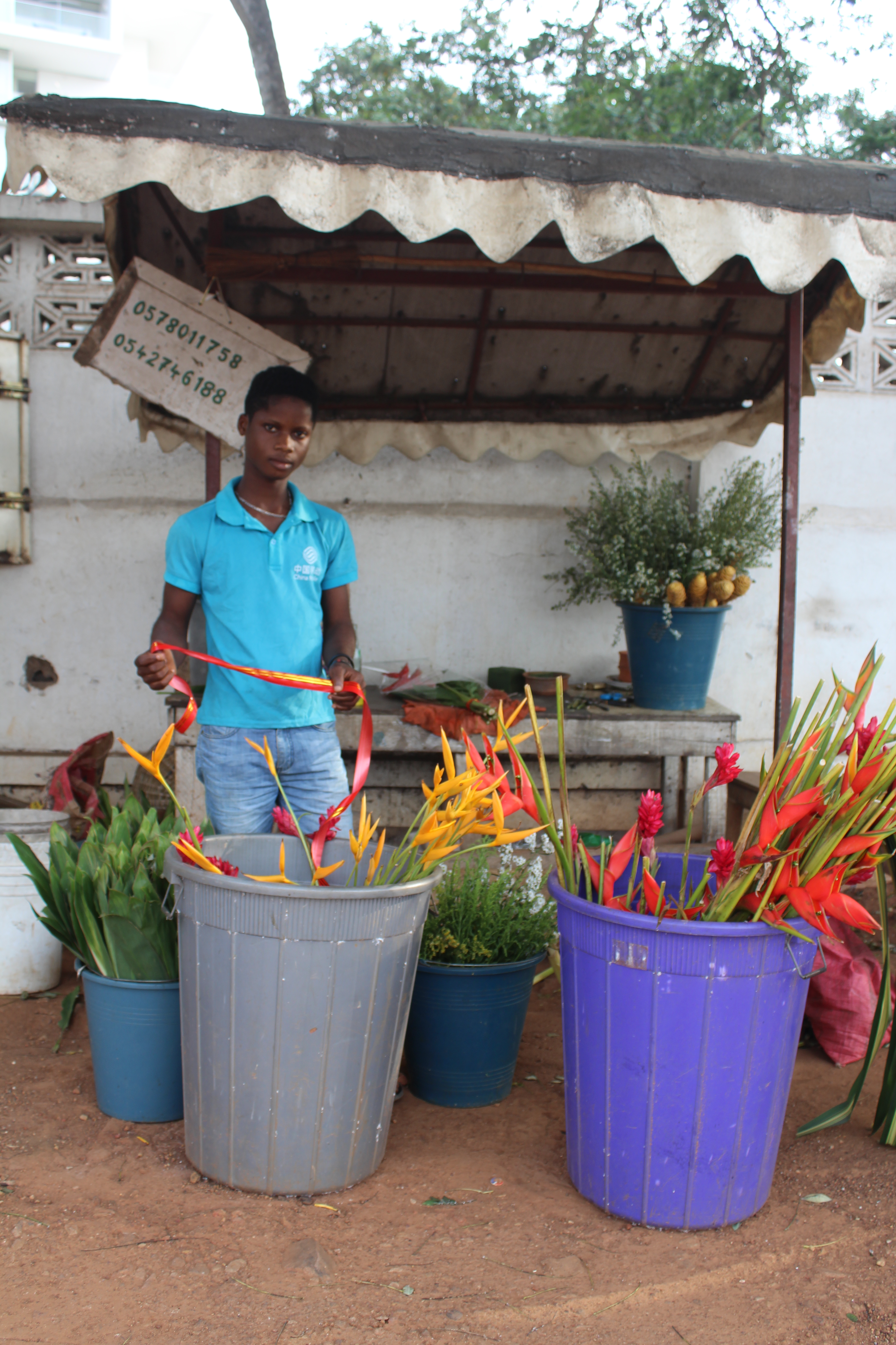 Flower seller off Accra's Oxford Street
