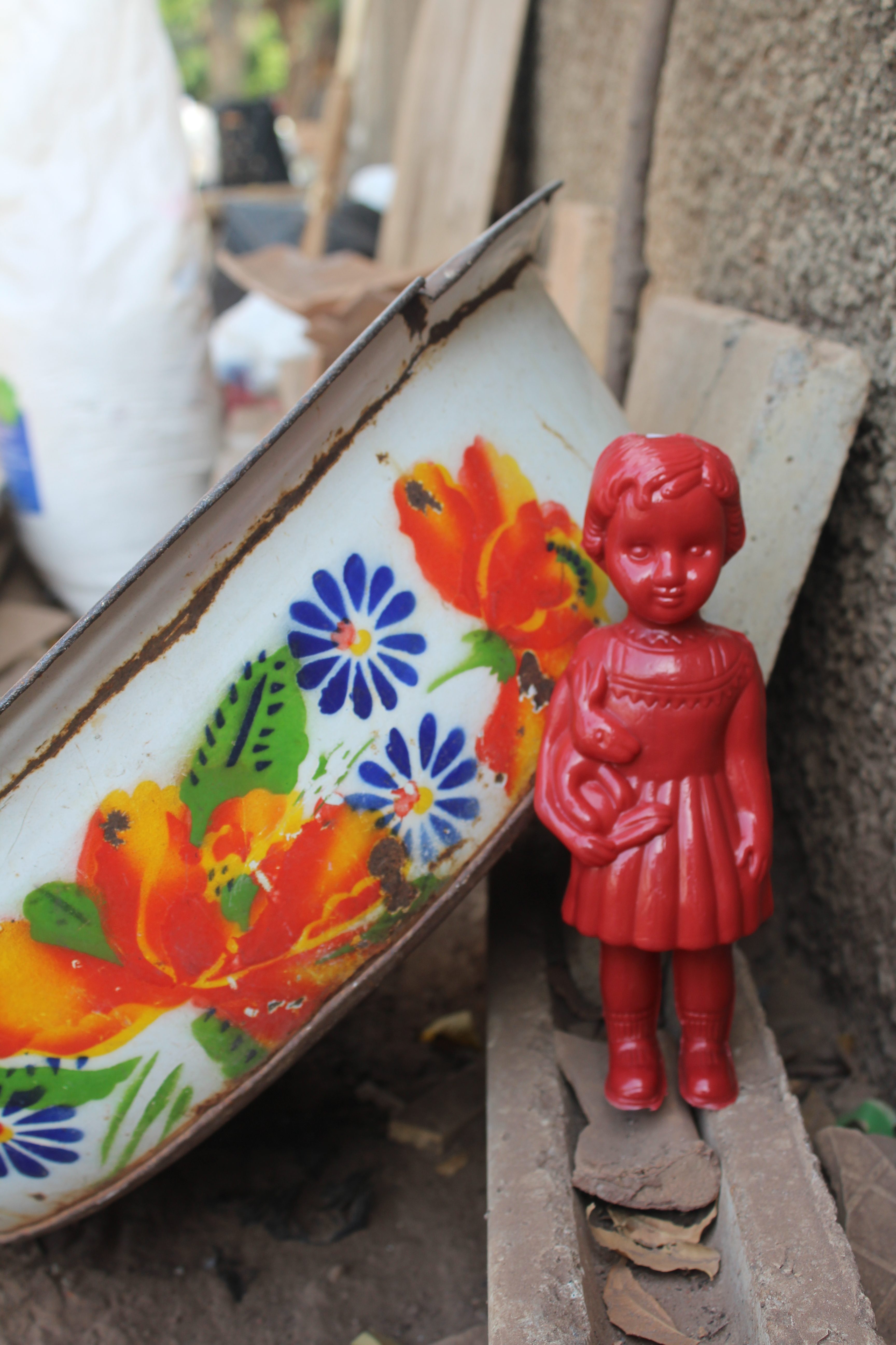 Red Clonette doll in Accra Ghana with a lady selling plantain