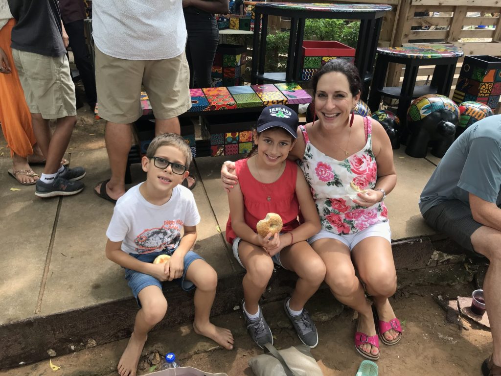 Eating Tyson's bagels at the Green Butterfly Market