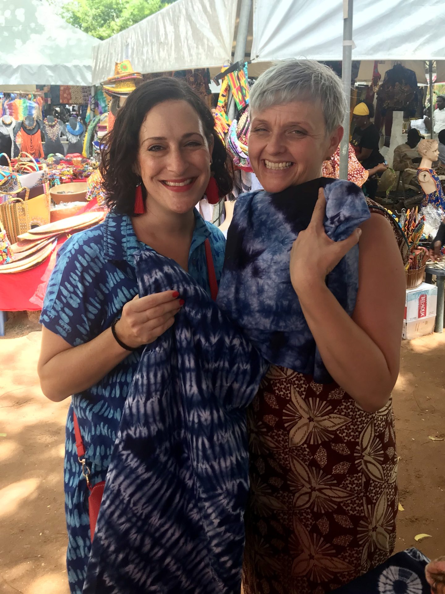 Buying batik fabric at the Green Butterfly Market