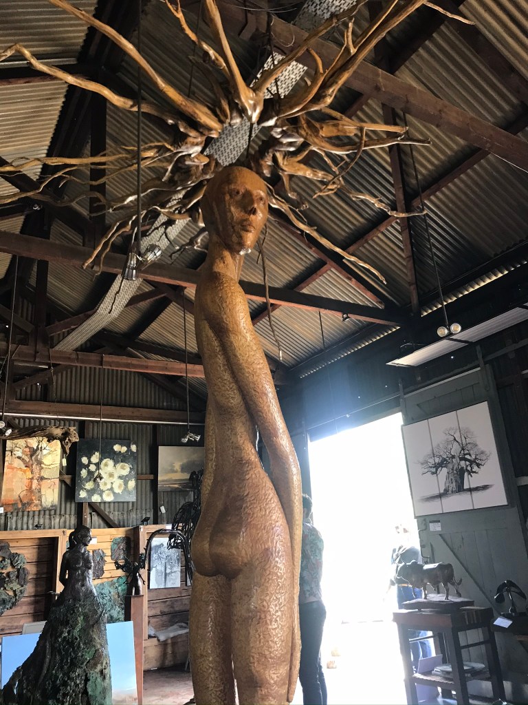 The Platform Gallery Lions River Howick - A sculpture of a man with sun rays on his head stands at the centre