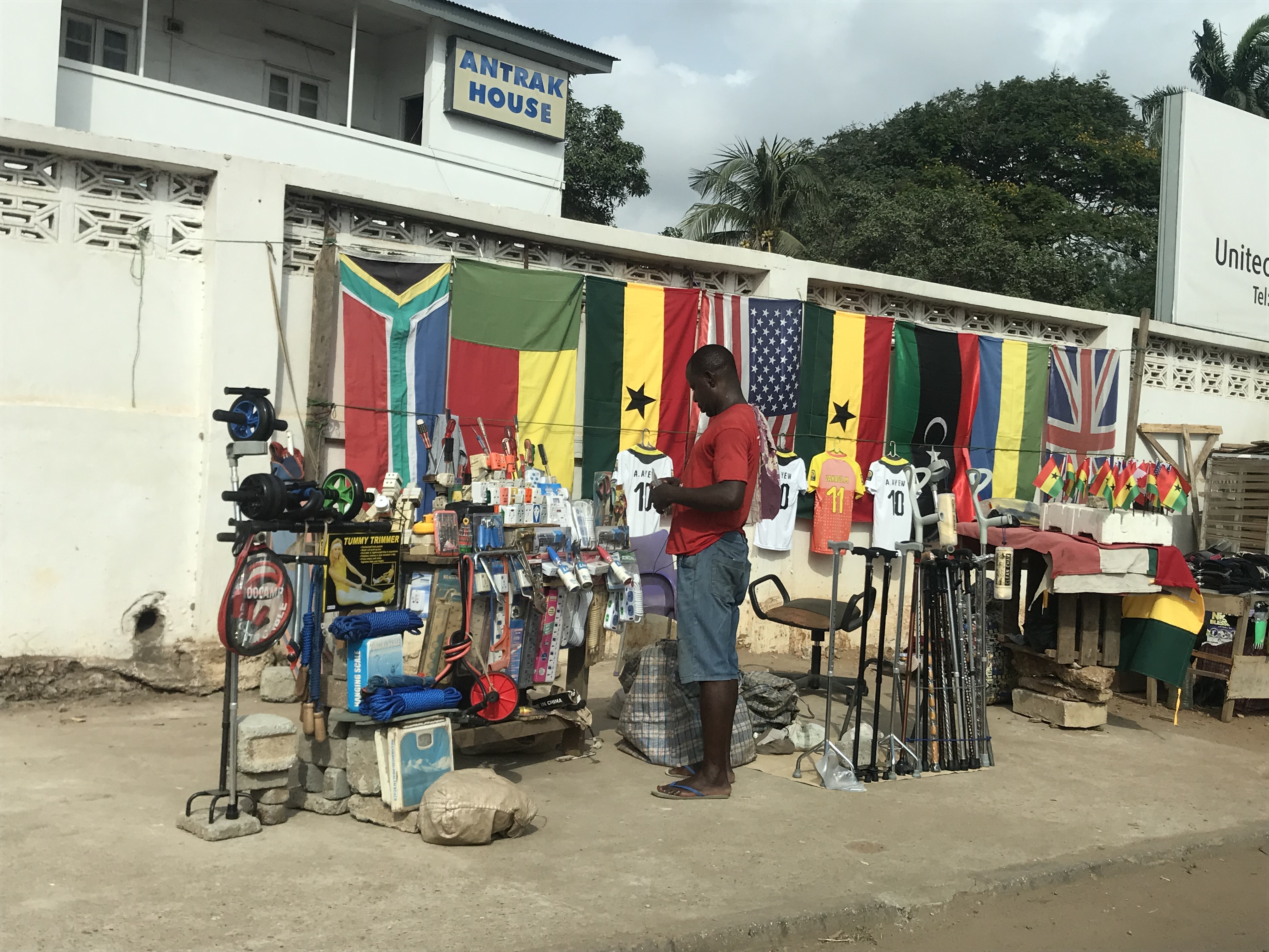 Quirky things for sale on Accra's Oxford Street including the flags of many countries