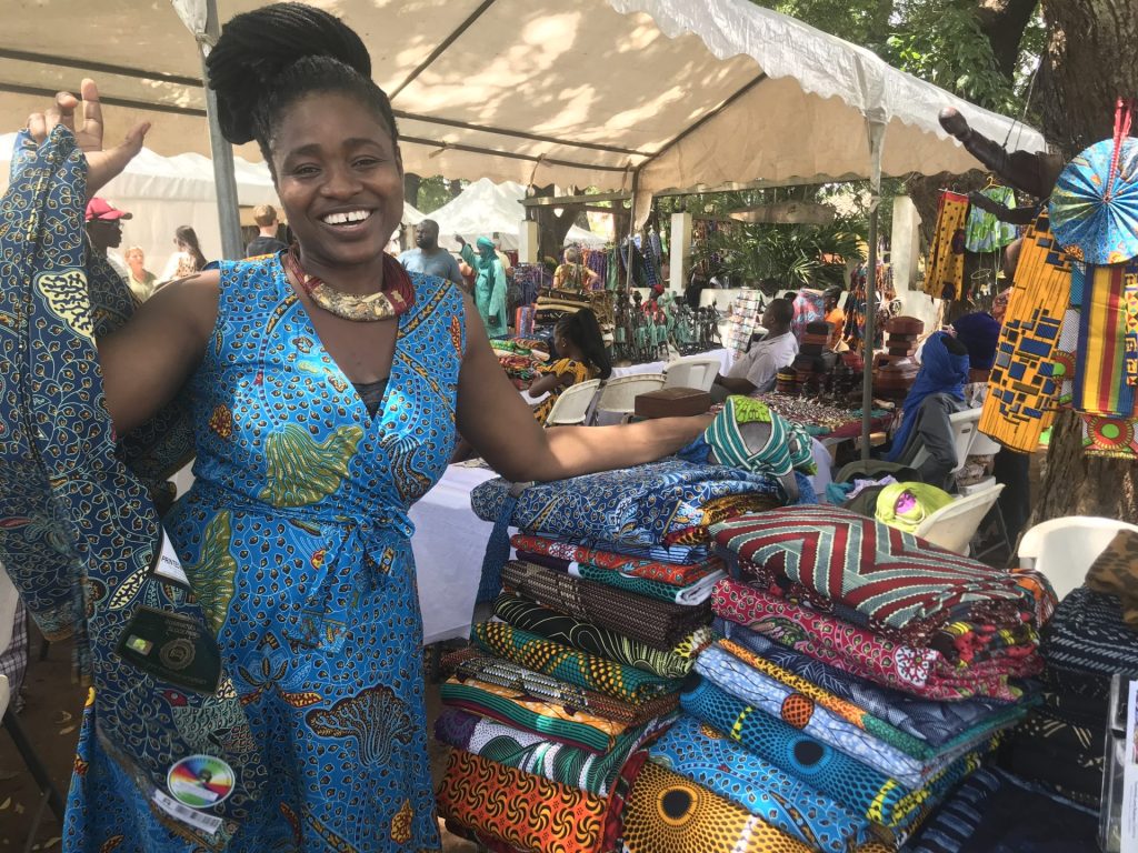 Elizabeth selling her clothes and fabric at the Green Butterfly Market